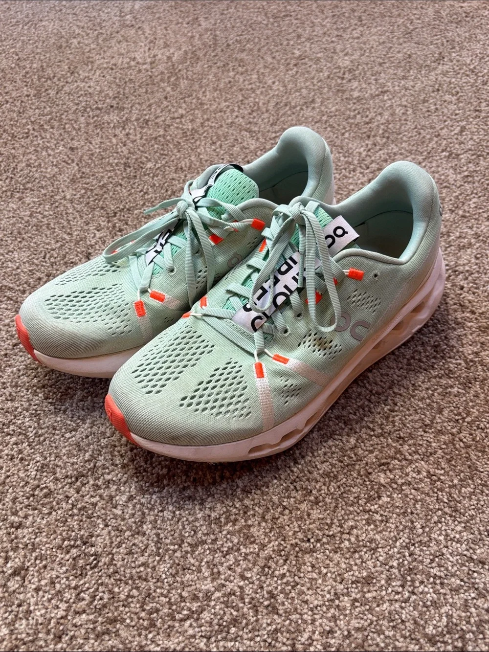 On Running Sneakers in Mint Green with Orange Accents